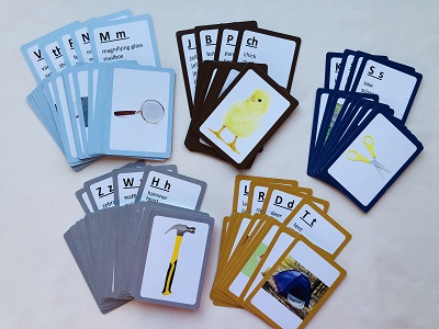 Blue, black, gray, and orange cards with pictures of objects on them.