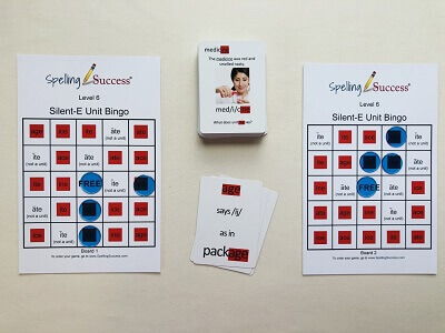 Level 6 Silent E Unit Bingo Game with bingo cards and discard pile of educational cards