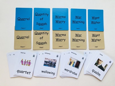 level 7 bossy W spelling rules game set up with blue cards on top, tan cards below and white cards at the bottom.