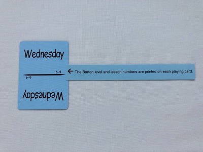 Blue card with word Wednesday on it with Barton level and lesson number